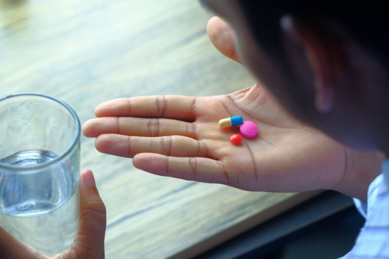 Person taking pill