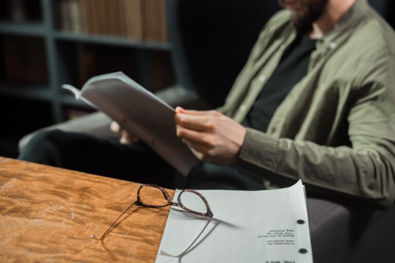 Researcher reading printed