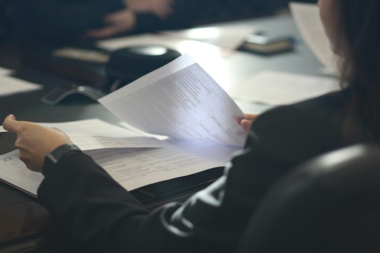 Researcher reading printed