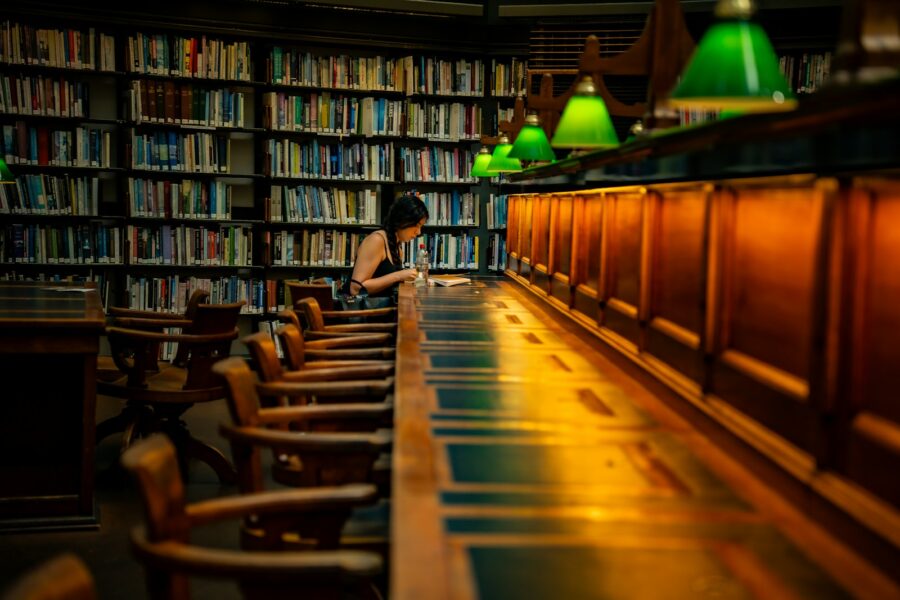 Student reading archival