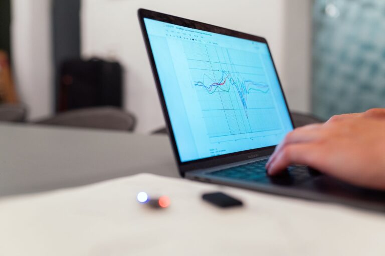 Researcher analyzing graphs